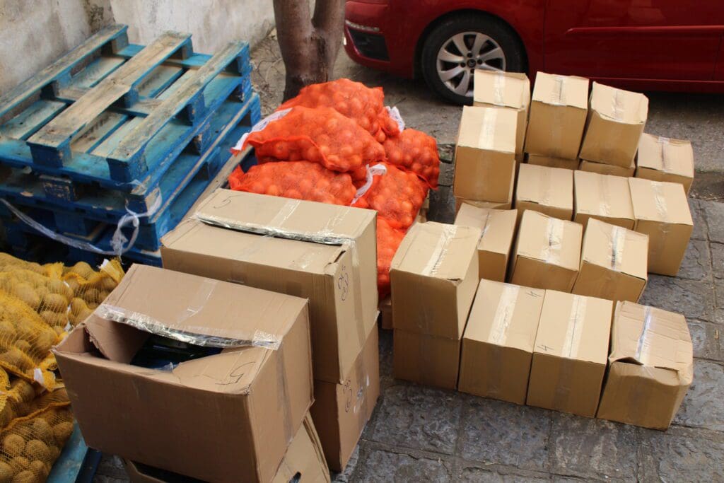 Cardboard boxes and orange onion sacks