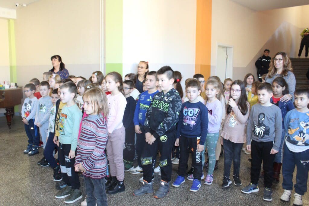Elementary school children standing in hallway