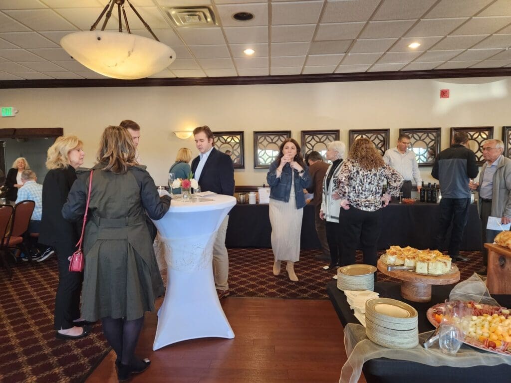 Guests mingling near buffet tables at reception