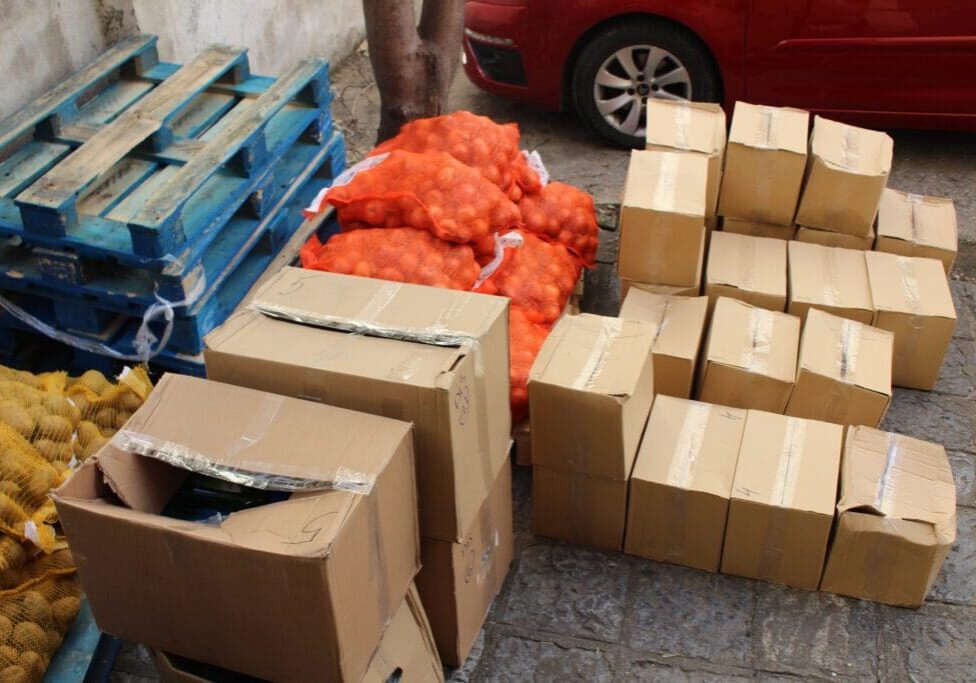 Cardboard boxes and orange onion sacks
