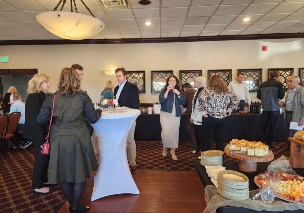 Guests mingling near buffet tables at reception