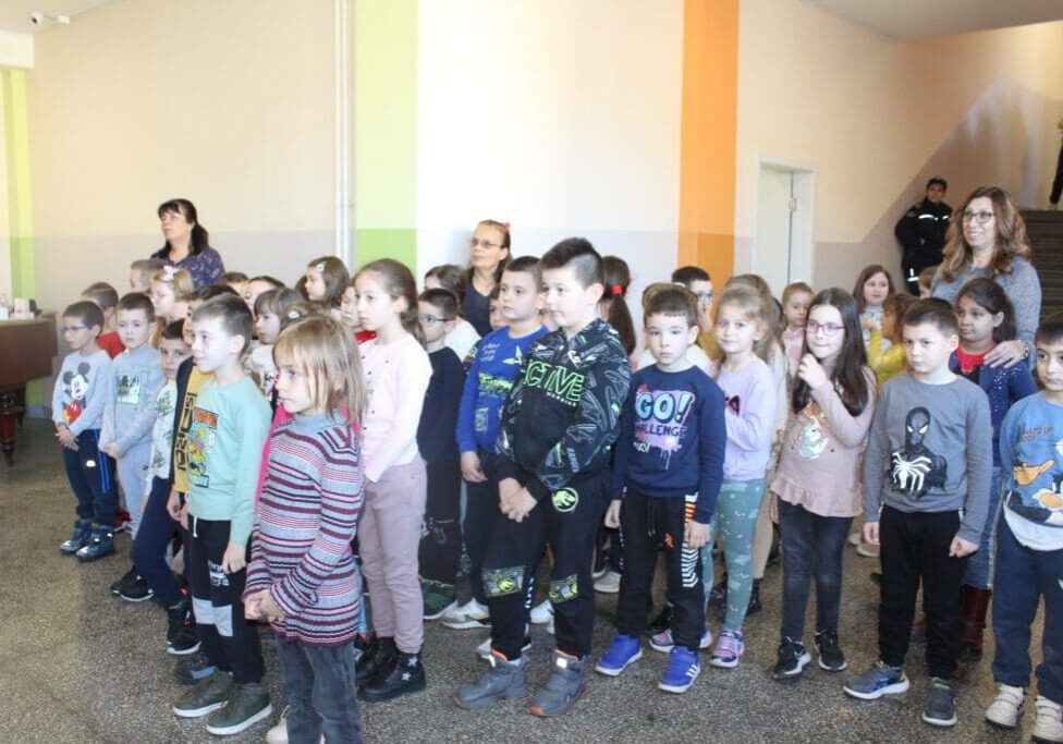 Elementary school children standing in hallway
